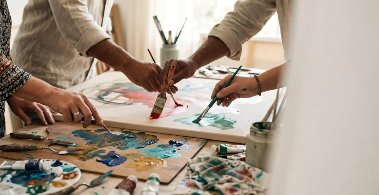 Diverse hands collaboratively creating art together in a communal workshop space